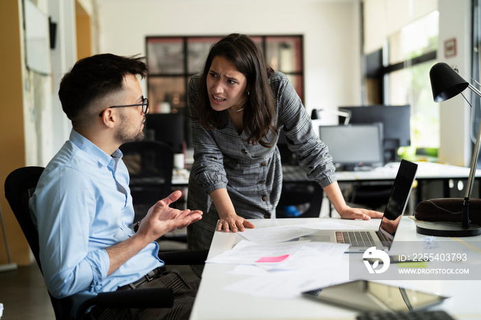 Colleagues arguing in office. Angry businesswoman yelling at her collegue.