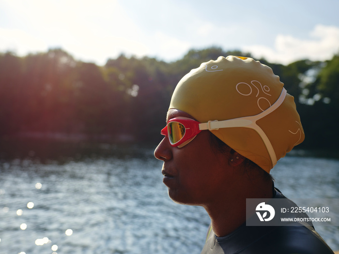 Woman in swimming cap and goggles