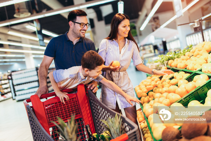 Family buying fruit in supermarket