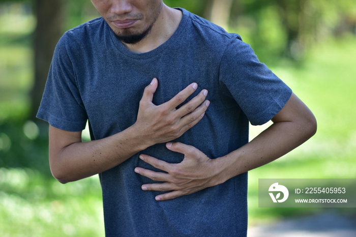 Man holding heart body problem when exercise