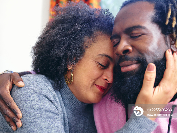 Couple embracing, close up