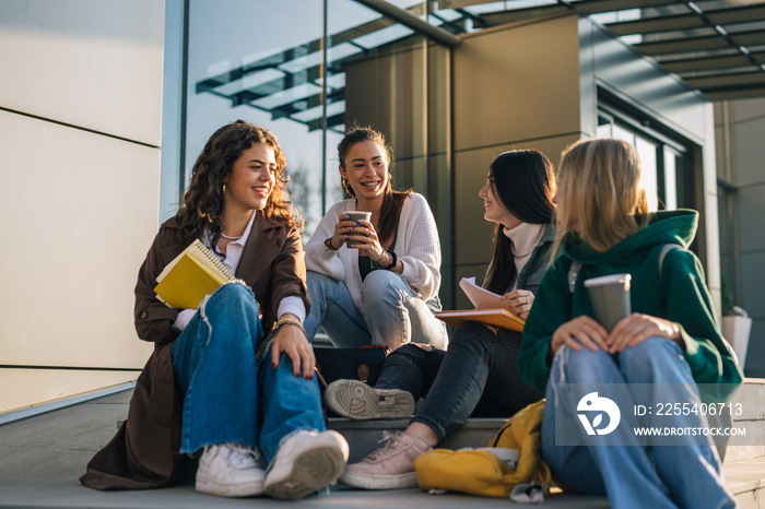 group of female college students outdoor in campus talking