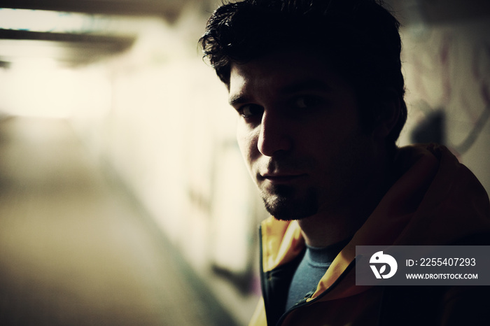 Close-up of a homeless Syrian refugee in an underpass.  A Syrian refugee man on the street in a European city.