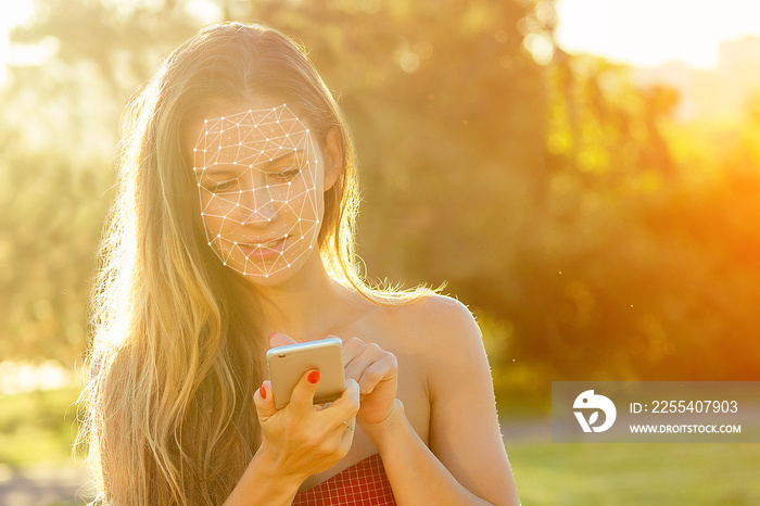 model woman long-haired in red dress holds phone and talking typing text with boyfriends in hand rays of sun background . enamored girl chating with friends in the park, concept face id