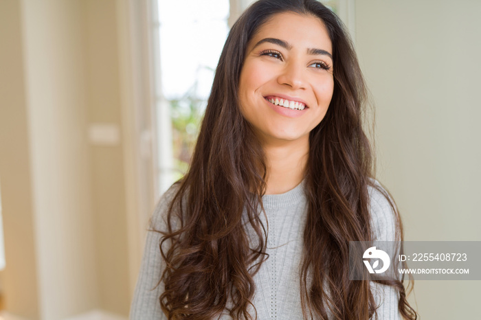 Beautiful brunette woman smiling cheerful, looking happy and positive