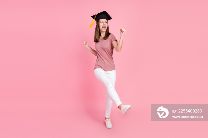 Full length body size view of attractive cheerful girl graduating dancing good mood isolated over pink pastel color background