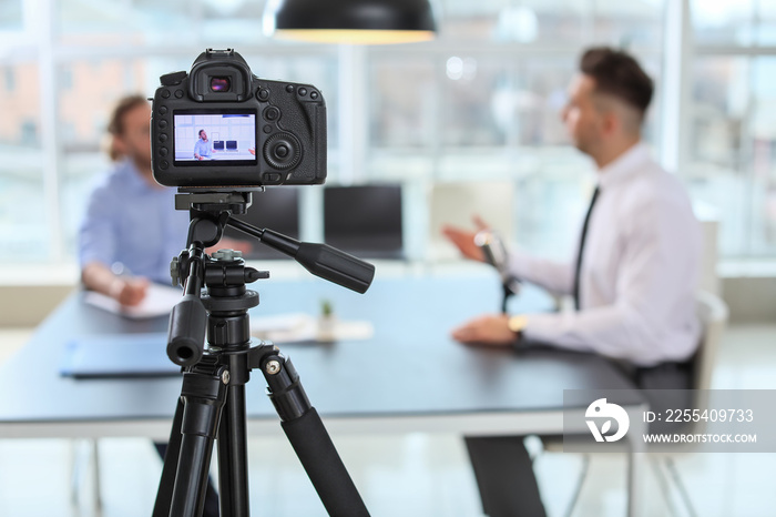 Filming of job interview with applicant in office