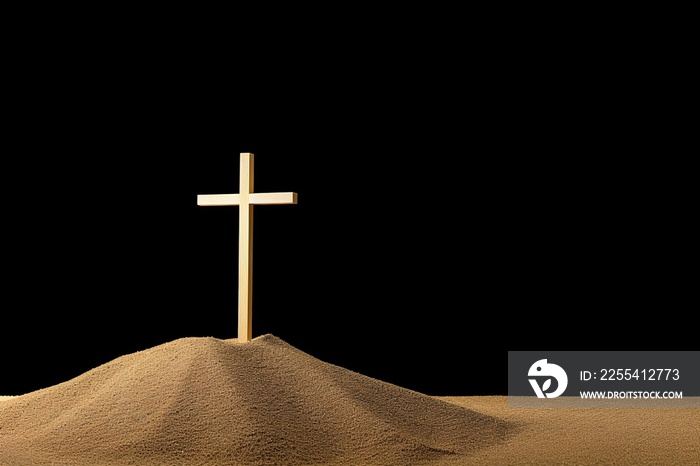 wooden cross in the sand on black color background