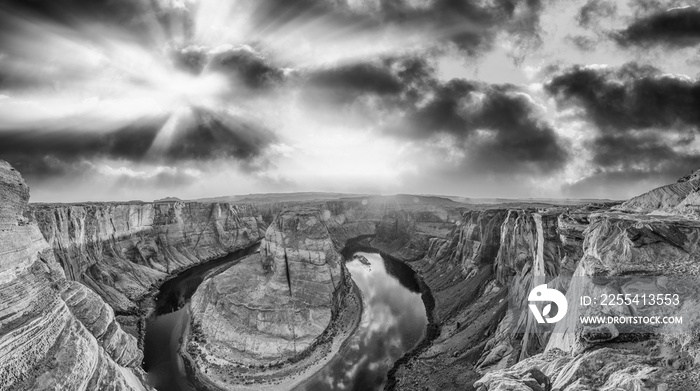 Horseshoe Bend panoramic aerial view, Arizona. Rocks and Colorado River at sunset in black and white.