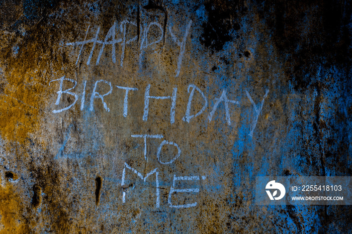 Happy Birthday, To Me, wrote on rough texture wall with blue-colored chalk, horizontal shot.