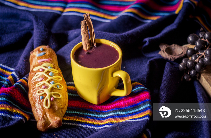 traditional dish and drink Ecuador, called: Colada Morada and bread guaguas