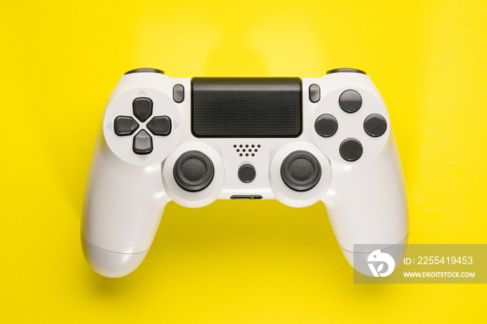 White Game Controller on yellow background