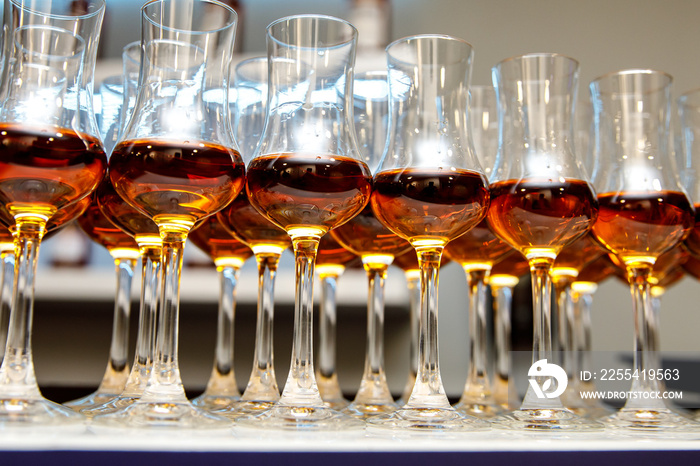 A lot of glasses with cognac.