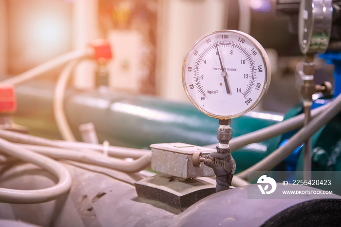 Pressure gauge on the cylinder of the industrial refrigeration. Pressure Gauge of Steel Tank Inside the refrigerant tank in the building at bangkok , Thailand.