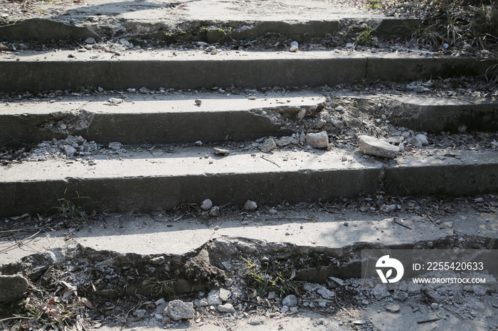 old destroyed concrete and stone steps of the stairs