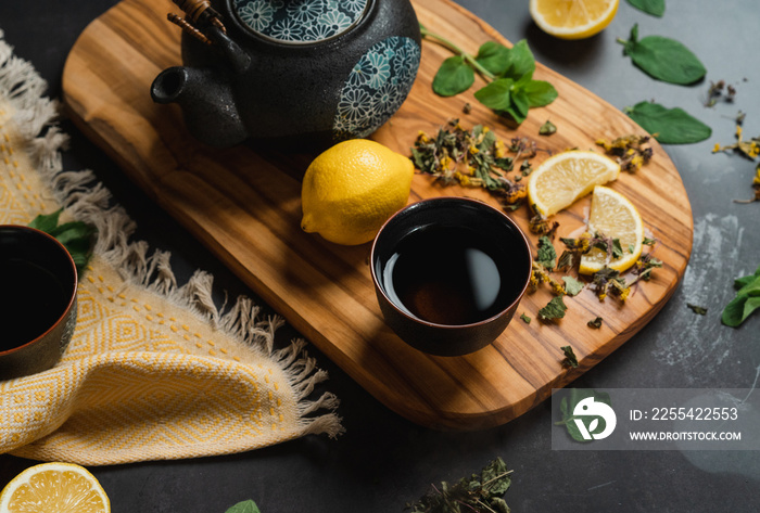 Japanese Tea pot with herbal tea and lemon and honey - professional photography in photo studio