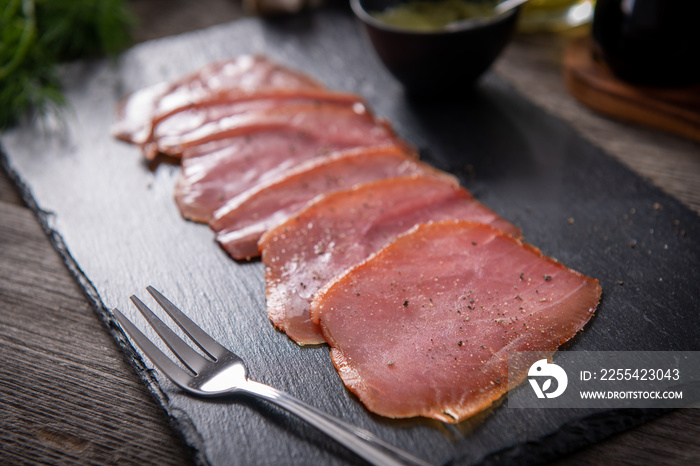 Tasty cold smoked tuna slices