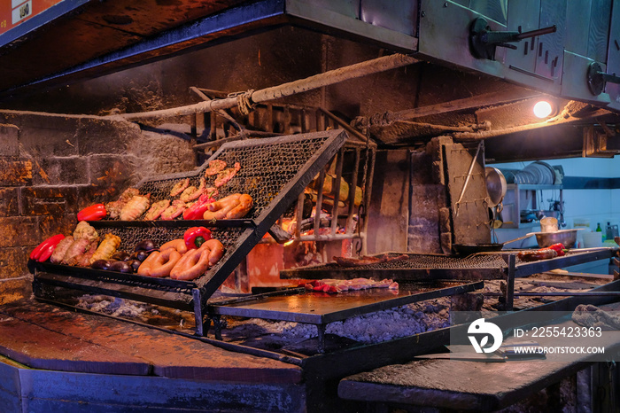 Asado parrillada grill bbq in famous old town Montevideo port market, mercado del puerto, Montevideo, Uruguay