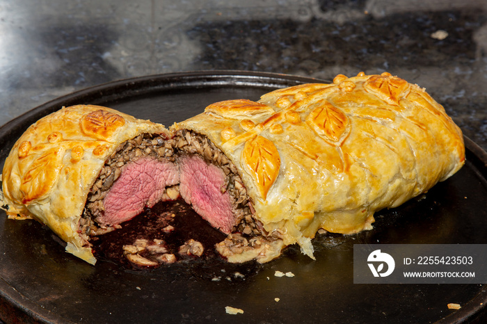 Wellington beef with filet mignon, champignon mushrooms, puff pastry and spices. Decorated and baked in the oven