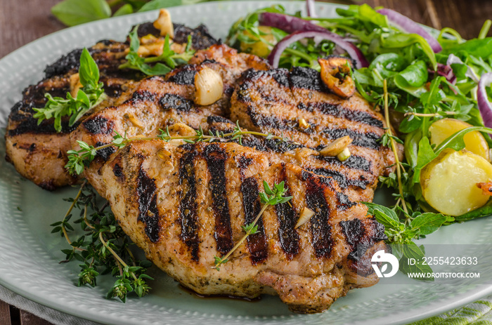 Grilled pork chops with lettuce salad