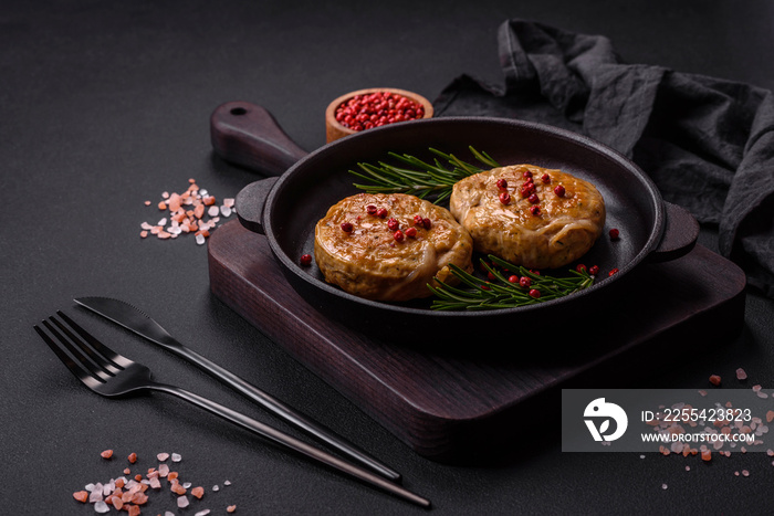 Grilled meatballs with spices and herbs or crepinette on a black plate