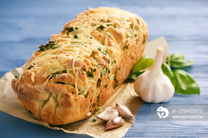 Homemade herb bread loaf with garlic and cheese.