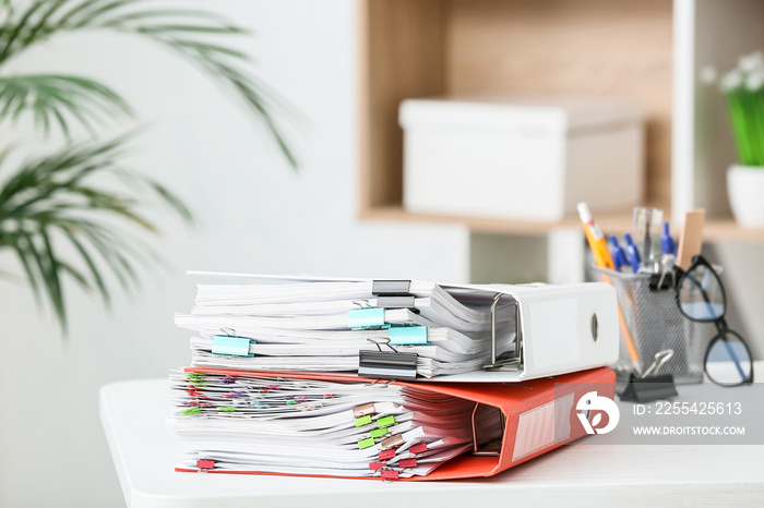 Stack of documents on table in office