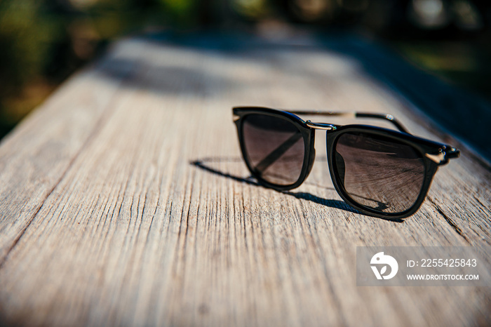 Vintage sunglasses on wooden table