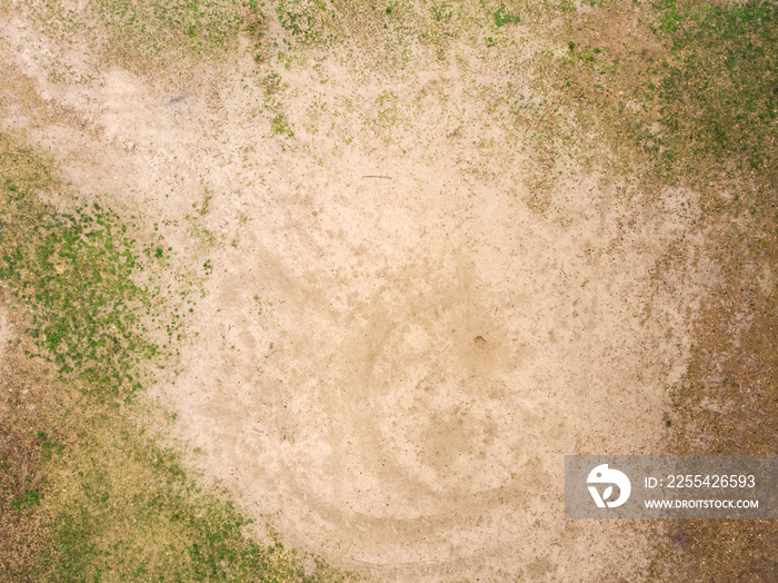 Glade with sand and grass - top view