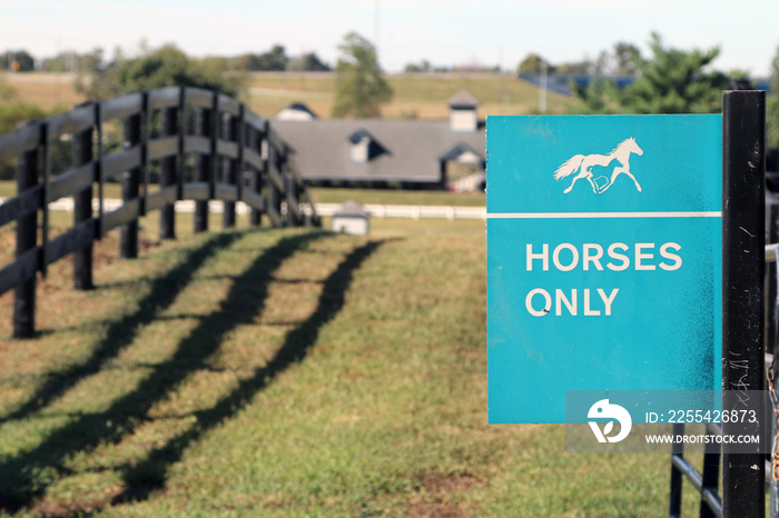 Horses Only  sign at the Kentucky Horse Park in Lexington.  There is a barn in the