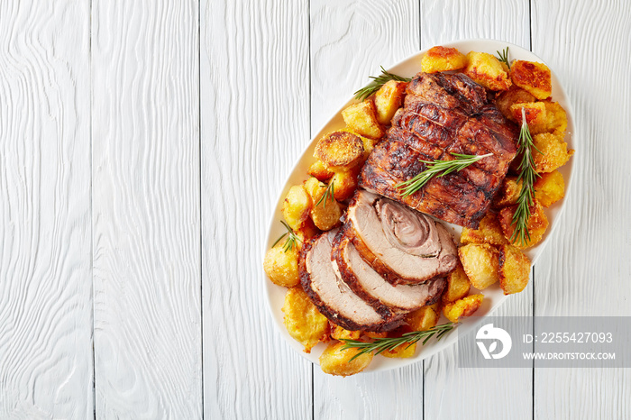 sliced roast pork roulade with potatoes