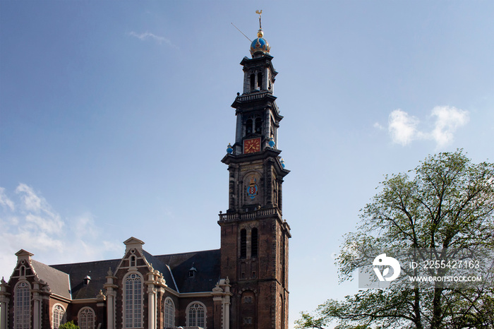 View of historical Westerkerk church in Amsterdam. 17th century structure with 85 meter tall spire. A crown-topped spire rises from this Renaissance-era Protestant church where Rembrandt is buried.