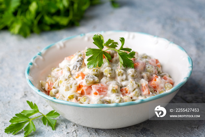 Russian salad Olivier with mayonnaise and egg served