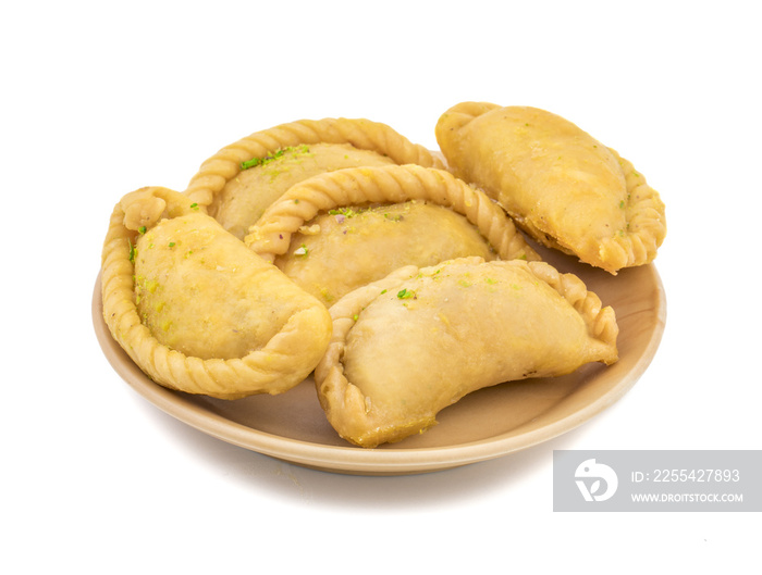 Gujiya or Gujia is a indian sweet dumpling made with suji, Maida or wheat flour and stuffed with khoya. It is common in North India, particularly in Bihar, Uttar Pradesh, Madhya Pradesh or Rajasthan