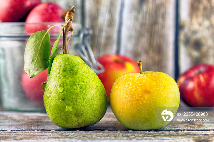 Fresh, real apple and pear from organic farming, ecological harvest on wood background.