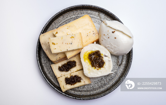 Gourmet cheeses, italian taleggio and mozzarella chesses with filling from black truffles mushrooms