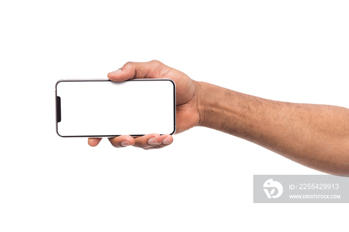 Male hand holding smartphone in horizontal orientation