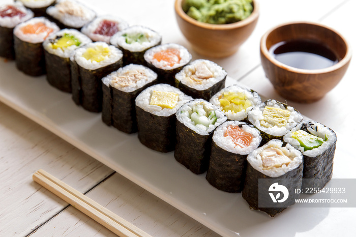 japanese food mini maki sushi platter on white wooden table