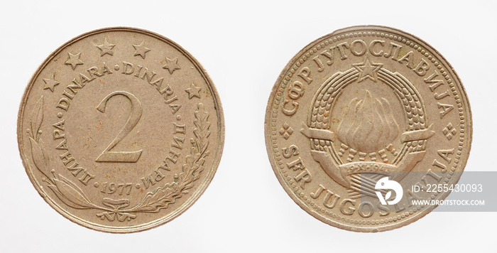 yugoslavia - circa 1977: a 2 Dinar coin of yugoslavia showing a torch fire as a coat of arms