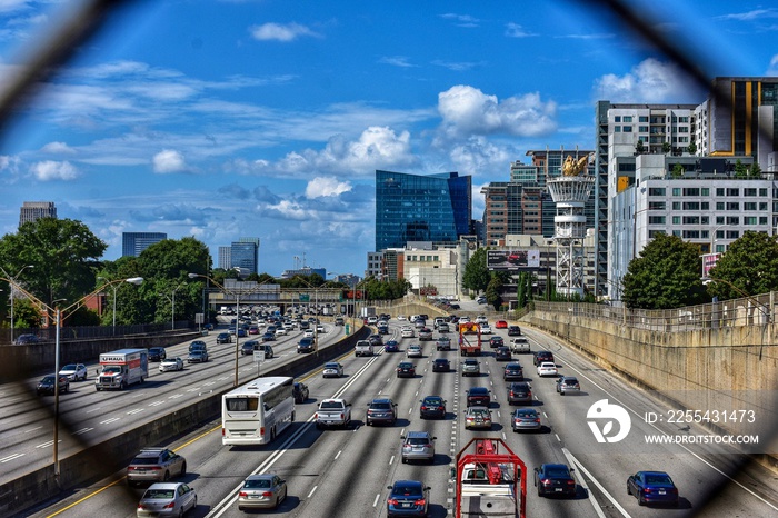 Viewing Atlanta traffic and landscape through a fence