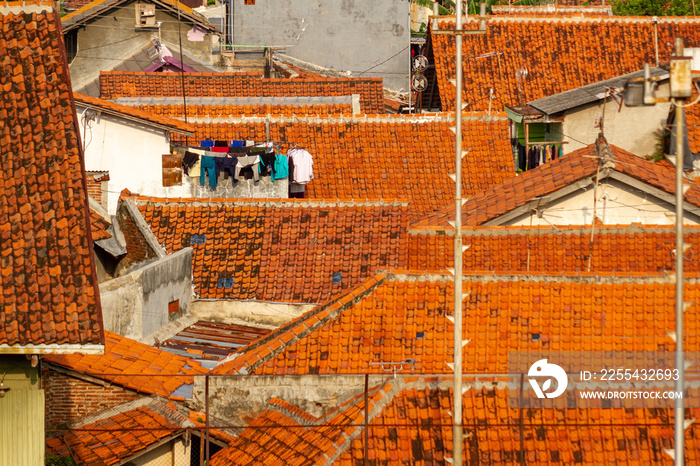 top view from the roofs of houses on the outskirts of Tegal, Indonesia, with a slightly cloudy sky background