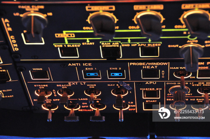 Overhead panel view of an Airbus A320, with lights switches and inoperative push button