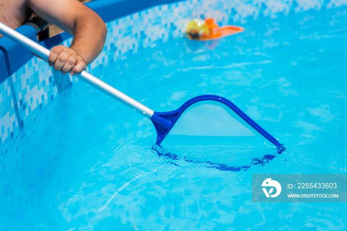 Backyard garden swimming pool cleaning close up