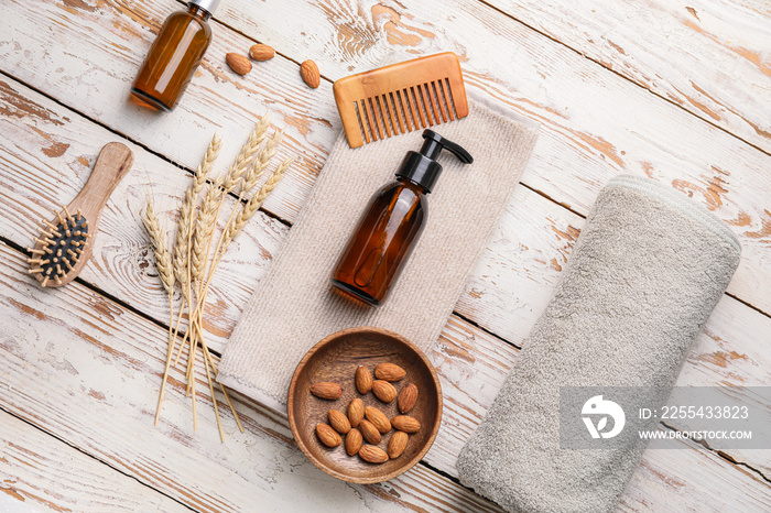 Composition with shampoo and natural ingredients on wooden background