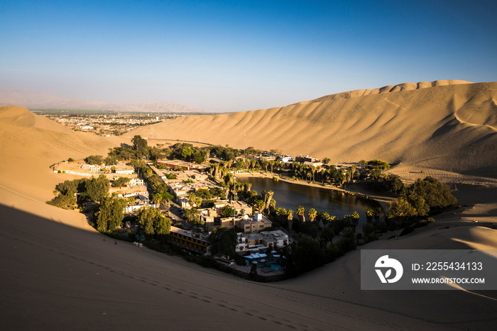 Huacachina, surrounded by sand dunes at sunset, Ica Region, Peru, South America