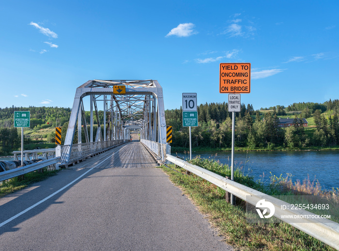 Entrance to old steel truss bridge crossing the Bow River at the town of Cochrane, Alberta