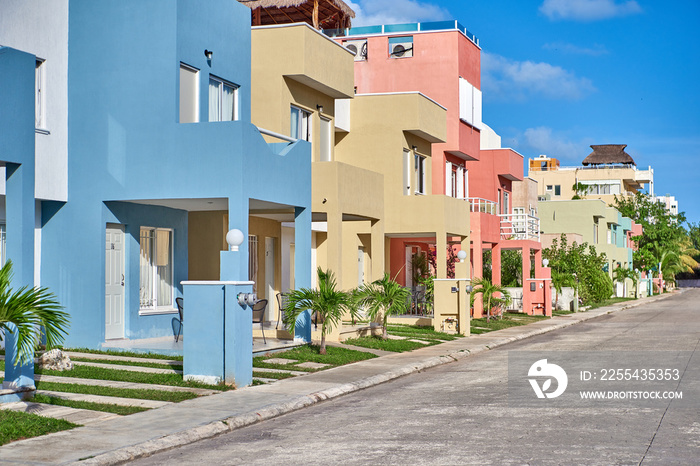 Modern residential buildings in Mexico are brightly colored. Dormitory area.