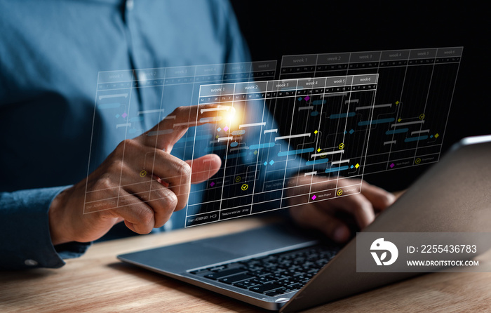 Analyst working with computer in Business Analytics and Data Management System to make report with KPI and metrics connected to database. Corporate strategy for finance, operations, sales, marketing.