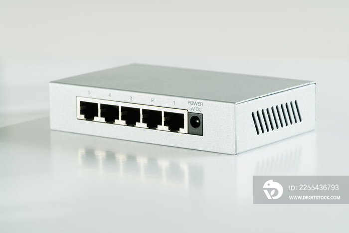 Small router and switch. tcp ip network business concept. High - performance gigabit switch. home network gray switch.