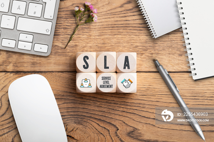 cubes with acronym SLA for  service level agreement  wooden background